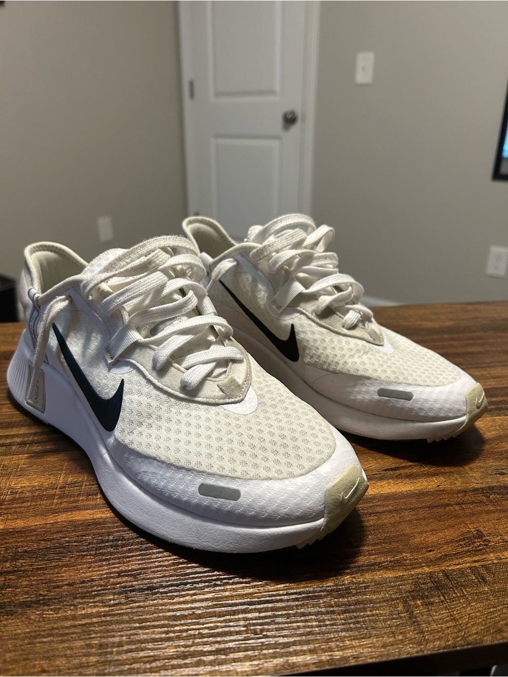 Nike White Sneakers with Black Swoosh Accents